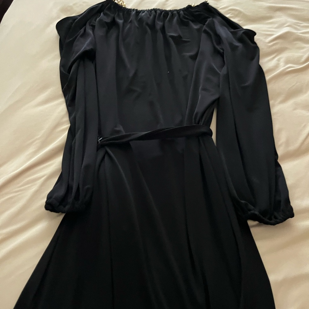 cocktail dress, hardware on the shoulders and gold very nice material black.